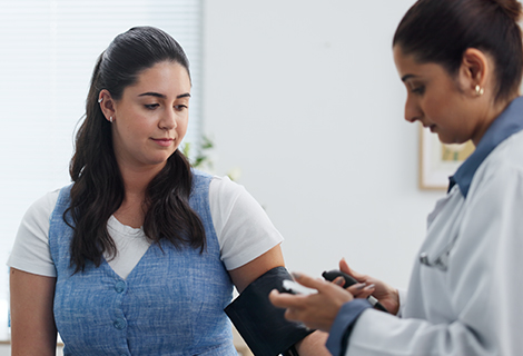 female doctor and female patient checking health.