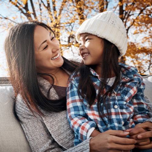 Woman and child smiling outdoor
