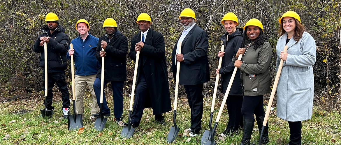 A group of people at a building groundbreaking