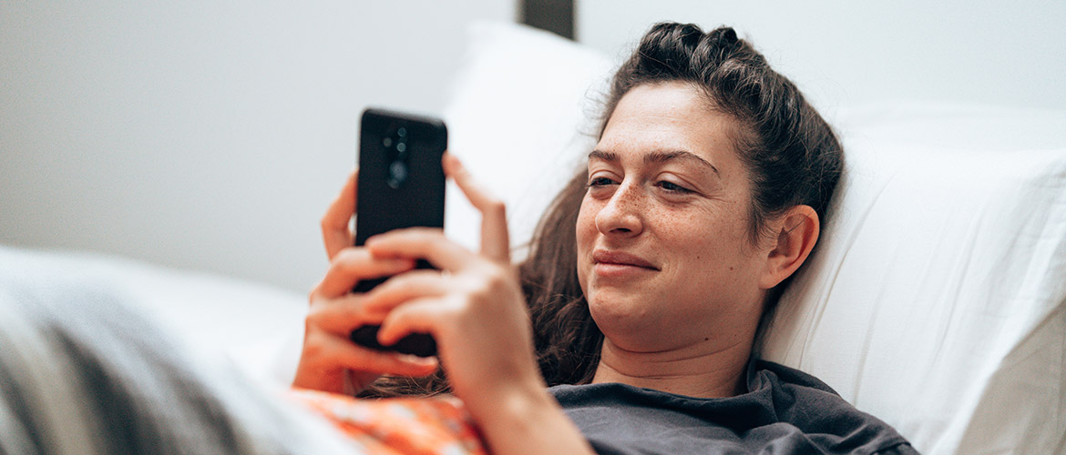woman looking at smart phone