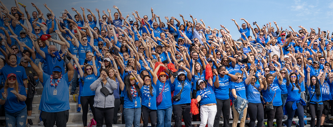 Bleachers of BCBSIL employees and community members pose together at Heart Walk event