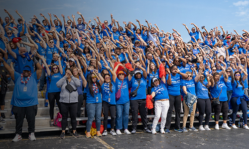 Bleachers of BCBSIL employees and community members pose together at Heart Walk event