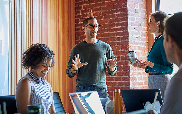 A diverse group of employees collaborating in office space