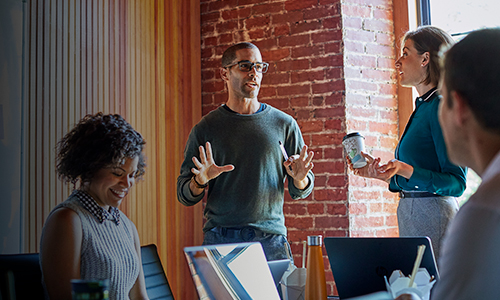 Group of diverse workers collaborating in office space