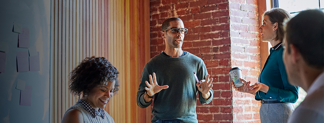 Group of diverse workers collaborating in office space