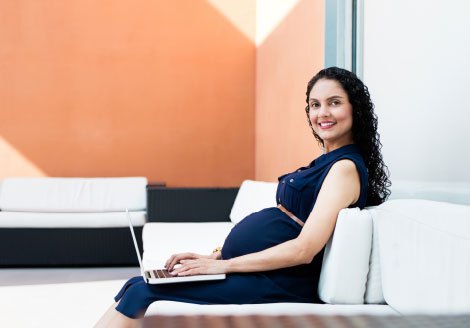 pregnant woman working on laptop
